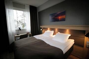 Фото номера Улучшенный трехместный номер Отель Hotelli Toivola г. Кеми 2