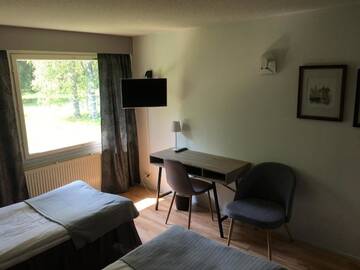 Фото номера Двухместный номер с 2 отдельными кроватями Отель Hotel Yöpuu г. Кеми 18